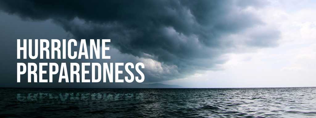 Storm clouds roll in over choppy ocean water. Text reads Hurricane Preparedness